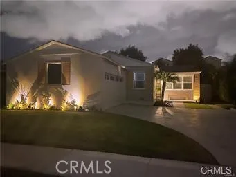 a front view of a house with yard