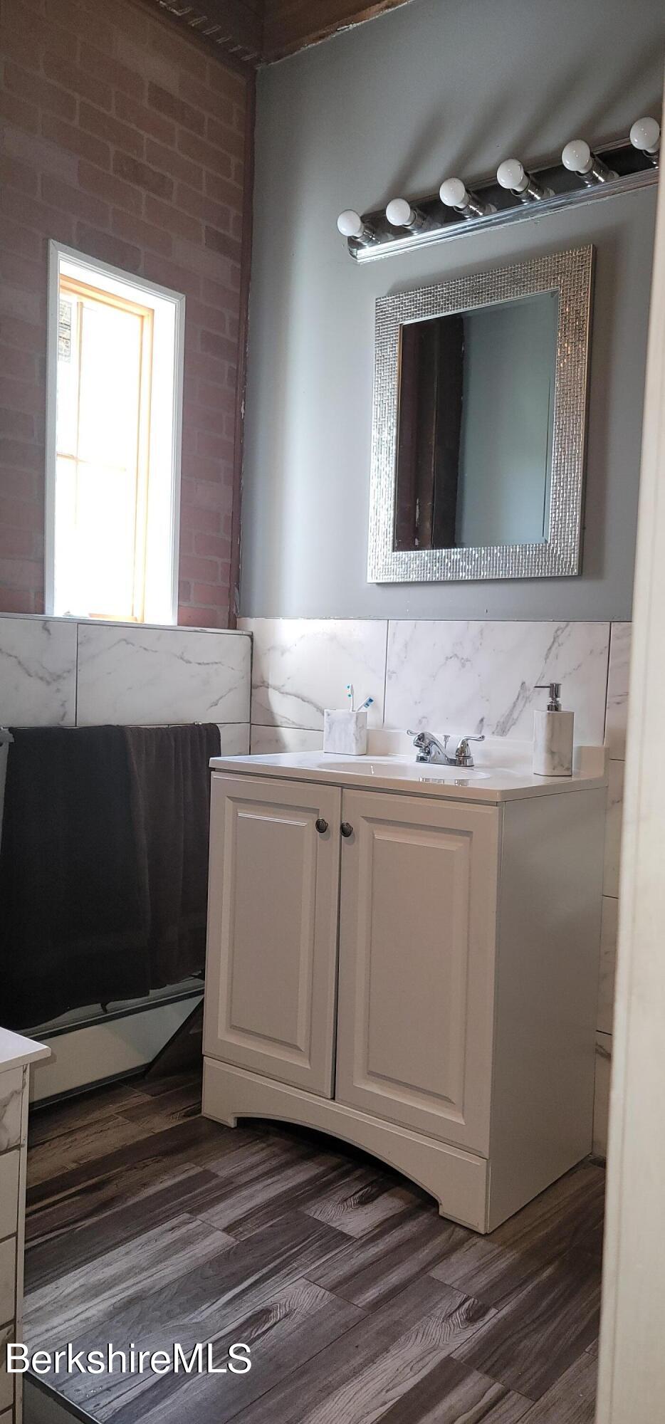 18 Grove Avenue Adams, MA 01220 - Photo 6 of 10 a bathroom with a sink and a mirror