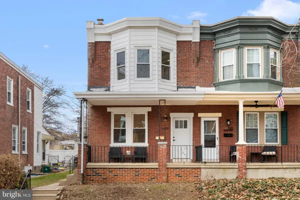 a front view of a residential apartment building with a yard