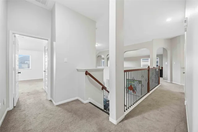 a view of a hallway view with staircase