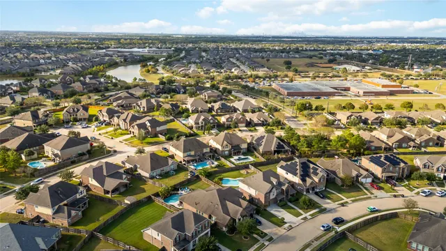 an aerial view of residential building with parking space