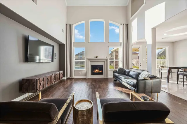 a living room with furniture fireplace and a flat screen tv