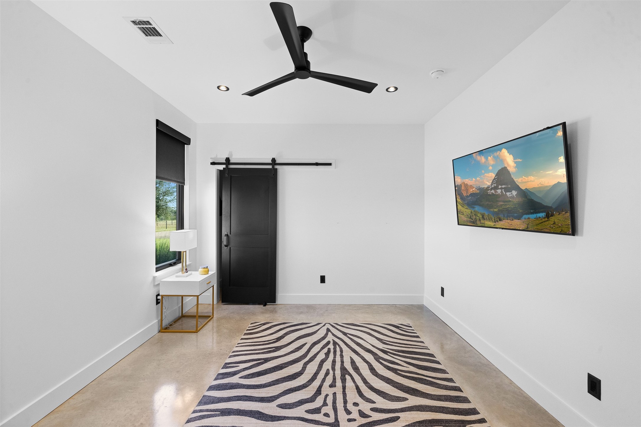 2134 Carter Road Bellville, TX 77418 - Photo 20 of 38 a bedroom with a bed and a painting on the wall