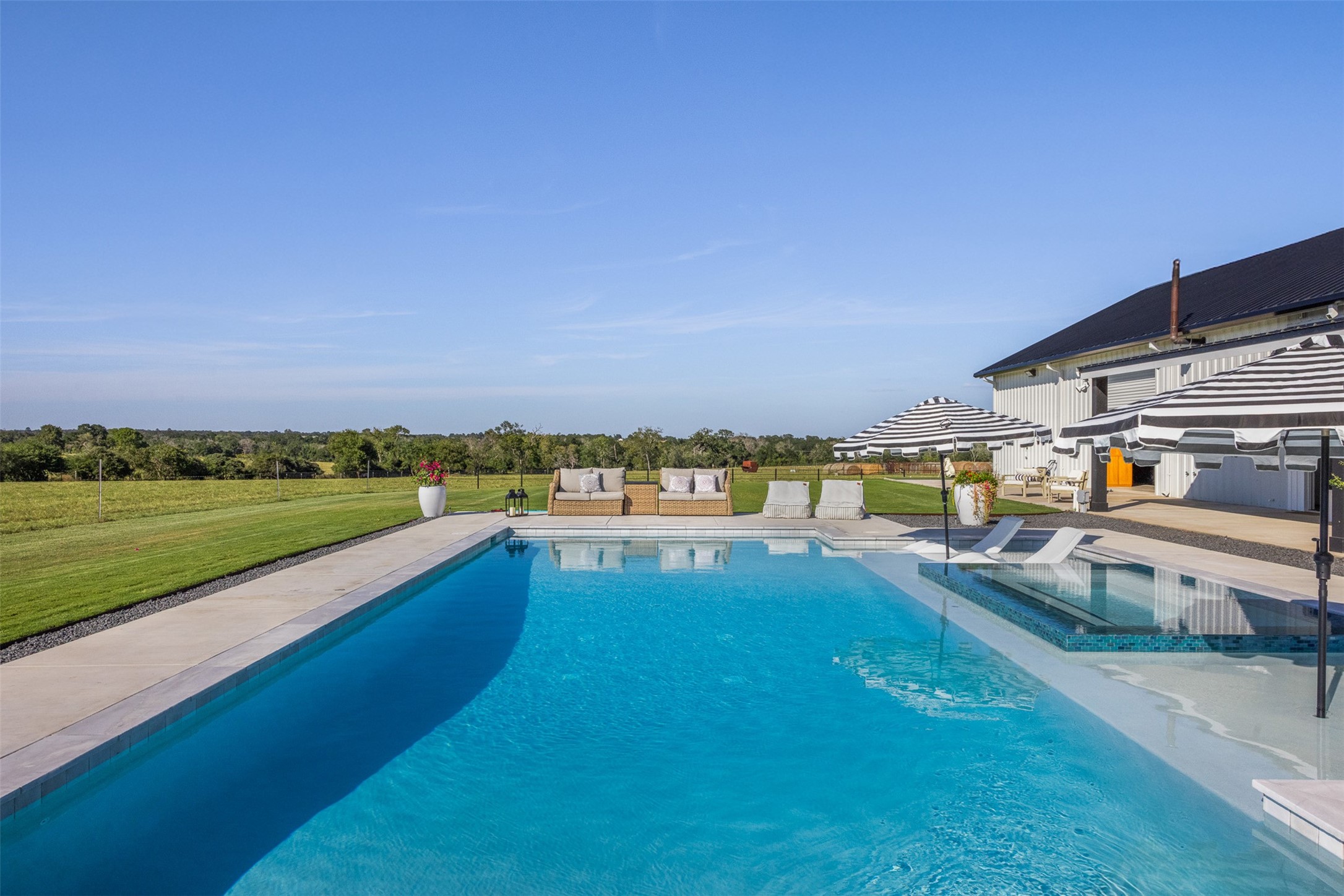 2134 Carter Road Bellville, TX 77418 - Photo 26 of 38 a view of swimming pool with outdoor seating and yard