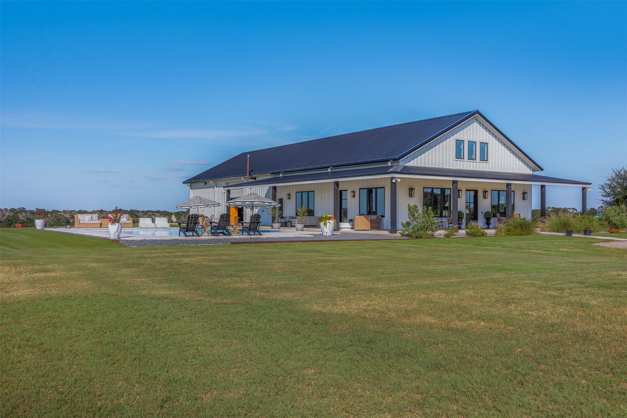 2134 Carter Road Bellville, TX 77418 - Photo 3 of 38 a front view of a house with a garden