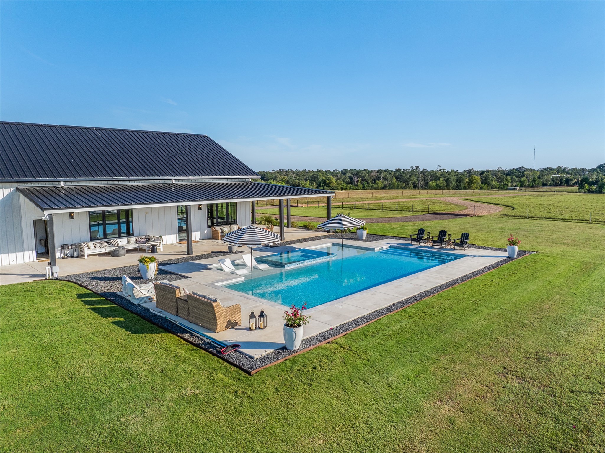 2134 Carter Road Bellville, TX 77418 - Photo 36 of 38 a view of a house with pool and chairs