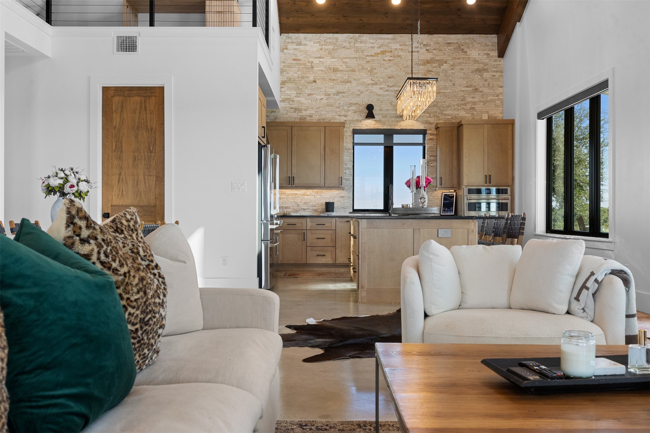 2134 Carter Road Bellville, TX 77418 - Photo 10 of 38 a living room with furniture and a chandelier
