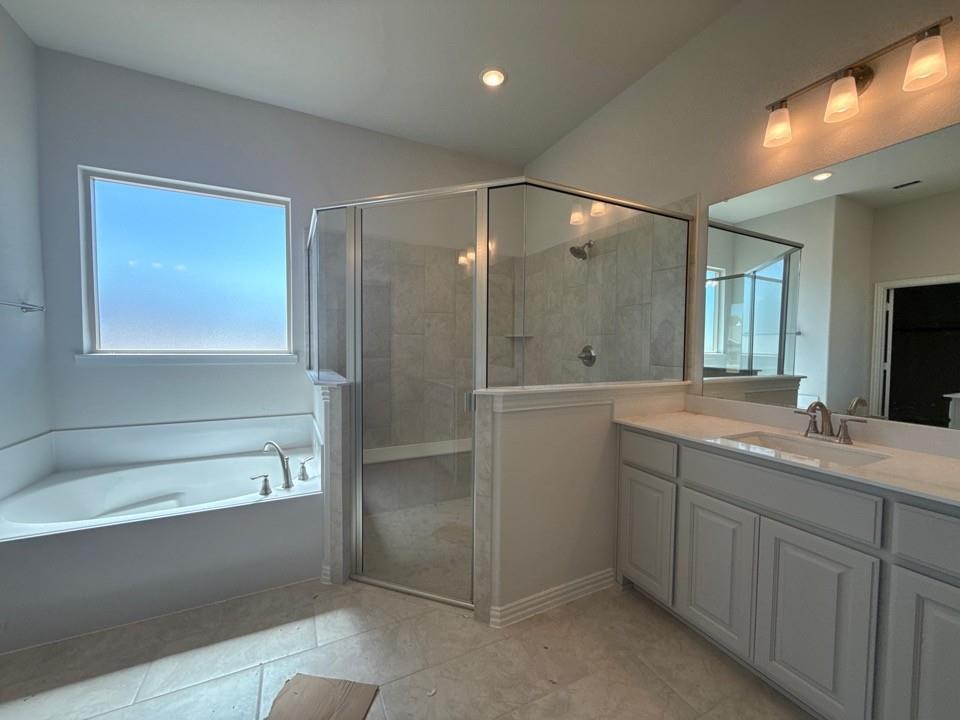 605 Tay Tay Way Springtown, TX 76082 - Photo 14 of 19 a bathroom with a shower sink and mirror