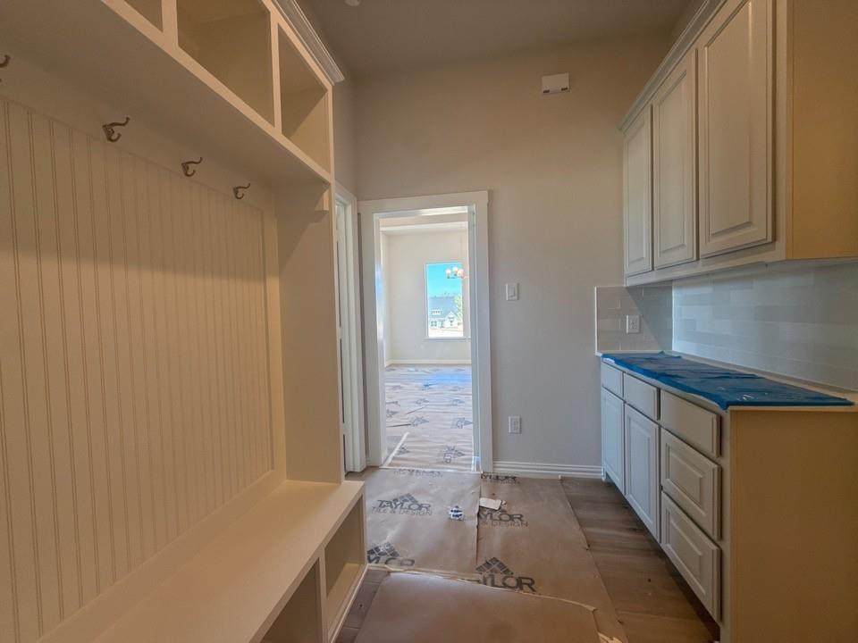 605 Tay Tay Way Springtown, TX 76082 - Photo 8 of 19 a bathroom with a granite countertop sink and a bathtub