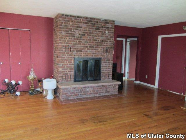 Heiden Road Monticello, NY 12701 - Photo 2 of 15 a living room with furniture and a fireplace