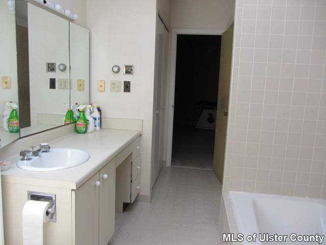 Heiden Road Monticello, NY 12701 - Photo 9 of 15 a en suite bathroom with a granite countertop sink and a mirror