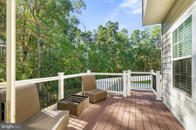 a view of balcony with wooden floor