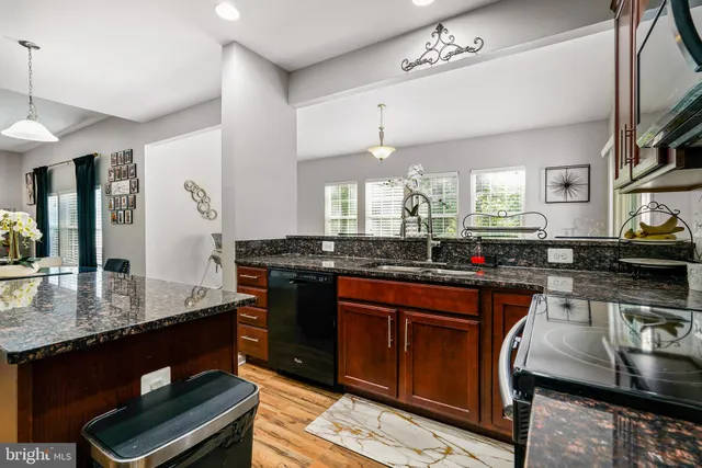 a large kitchen with granite countertop lots of counter top space