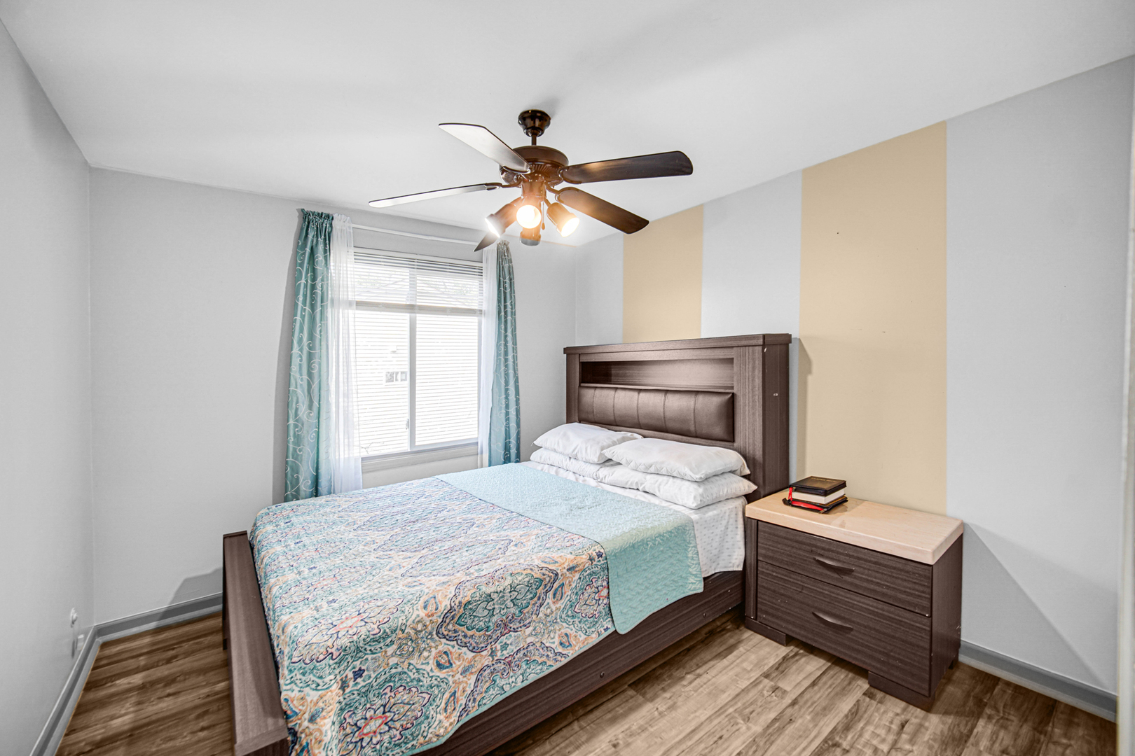 1326 Spring Valley Drive, Unit 1326 Carol Stream, IL 60188 - Photo 11 of 18 a bedroom with a bed and a chandelier