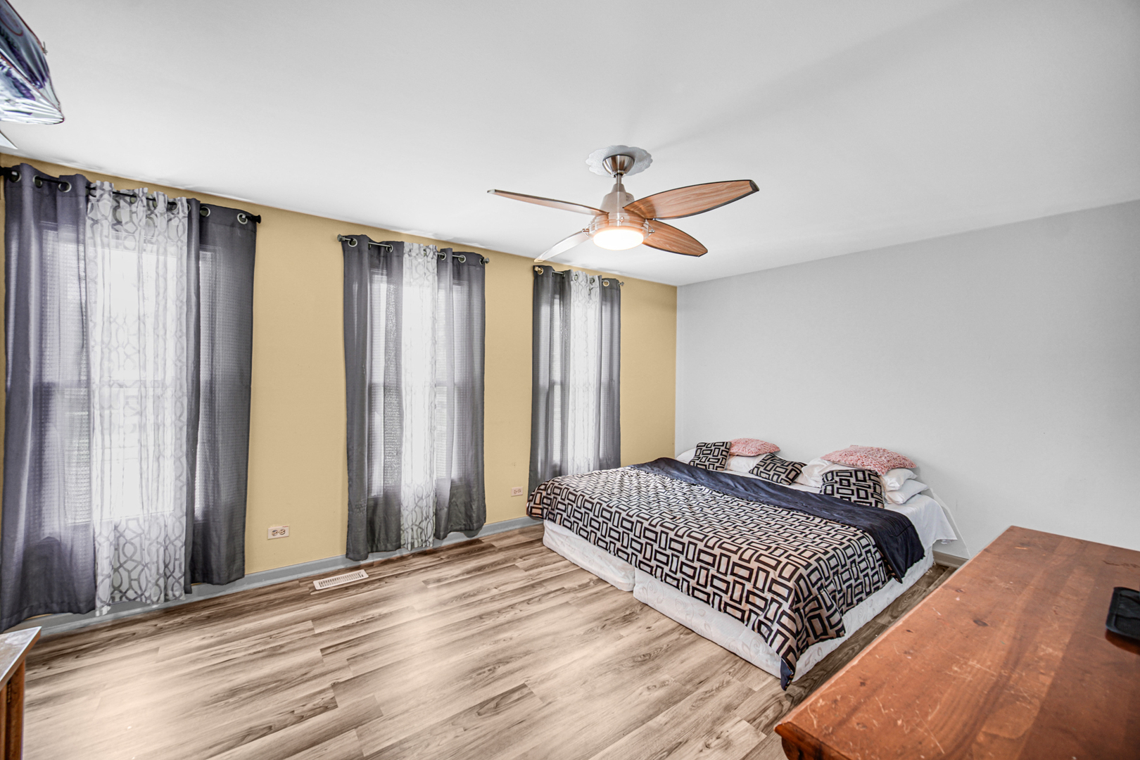 1326 Spring Valley Drive, Unit 1326 Carol Stream, IL 60188 - Photo 12 of 18 a bedroom with a large bed and a chandelier