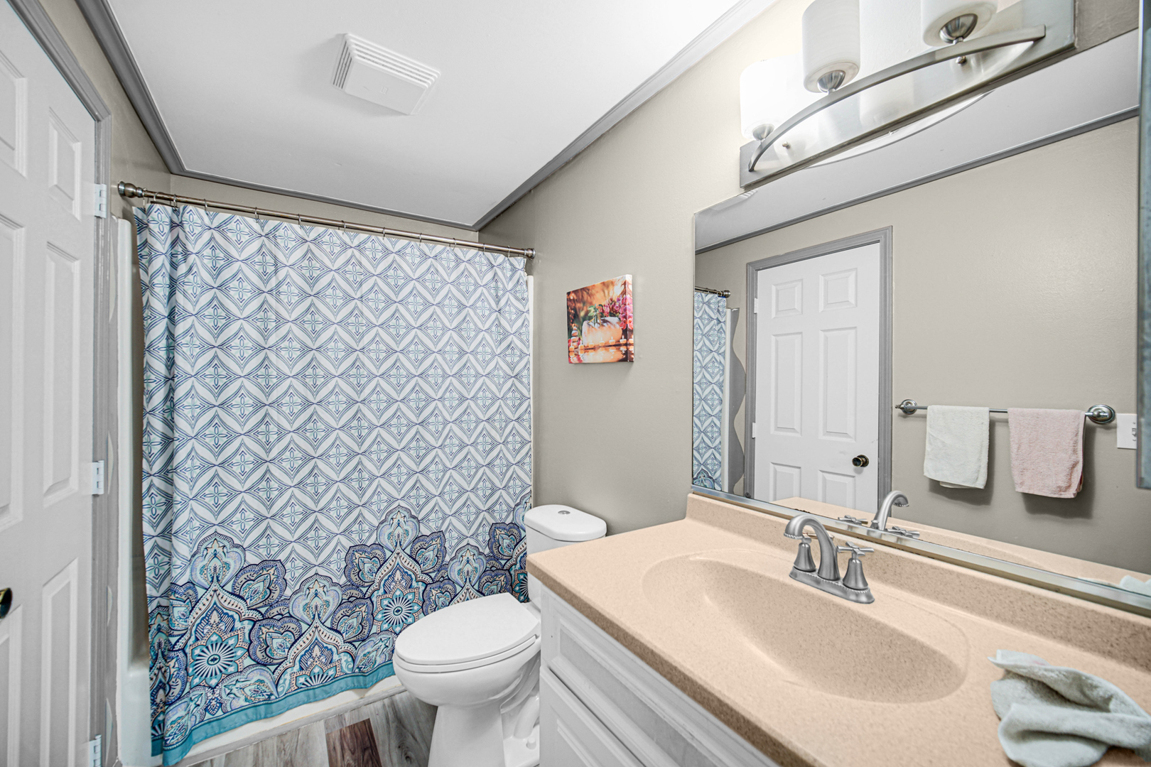 1326 Spring Valley Drive, Unit 1326 Carol Stream, IL 60188 - Photo 13 of 18 a bathroom with a sink a toilet and shower curtain