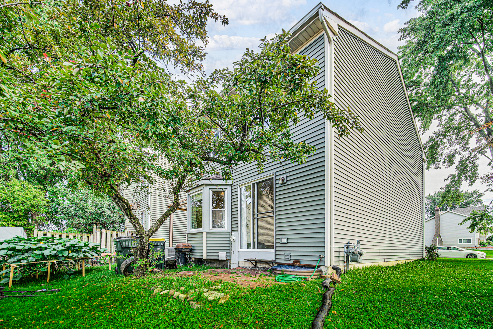 1326 Spring Valley Drive, Unit 1326 Carol Stream, IL 60188 - Photo 3 of 18 a view of a house with a backyard