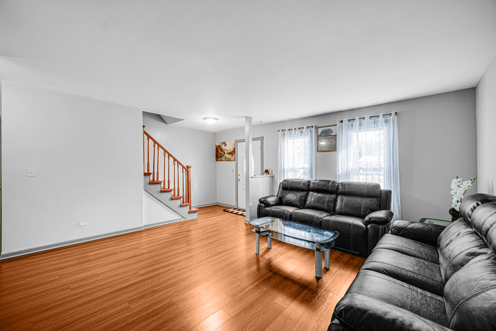 1326 Spring Valley Drive, Unit 1326 Carol Stream, IL 60188 - Photo 4 of 18 a living room with furniture and wooden floor