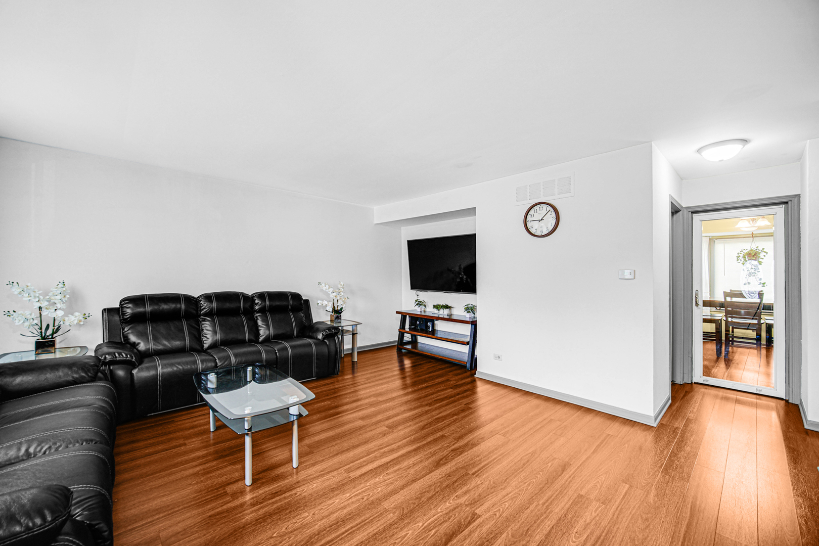 1326 Spring Valley Drive, Unit 1326 Carol Stream, IL 60188 - Photo 5 of 18 a living room with furniture and a wooden floor