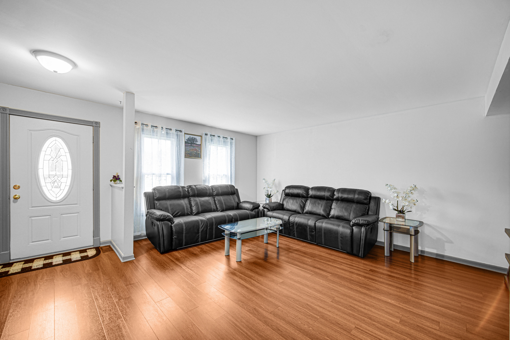 1326 Spring Valley Drive, Unit 1326 Carol Stream, IL 60188 - Photo 6 of 18 a living room with furniture and wooden floor