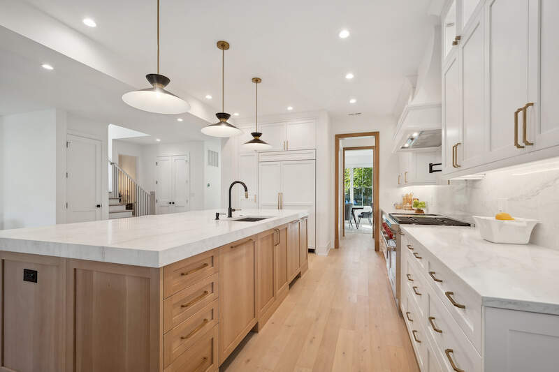 1209 Maple Avenue Wilmette, IL 60091 - Photo 19 of 28 a large kitchen with kitchen island a sink a center island a stove and a cabinets