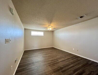 5845 7th Street, Unit B Lubbock, TX 79416 - Photo 4 of 11 wooden floor in an empty room
