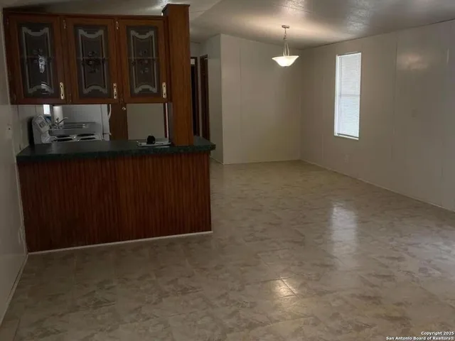 a white refrigerator freezer sitting inside of a kitchen