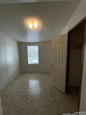 a white toilet sitting next to a bathroom sink and tub