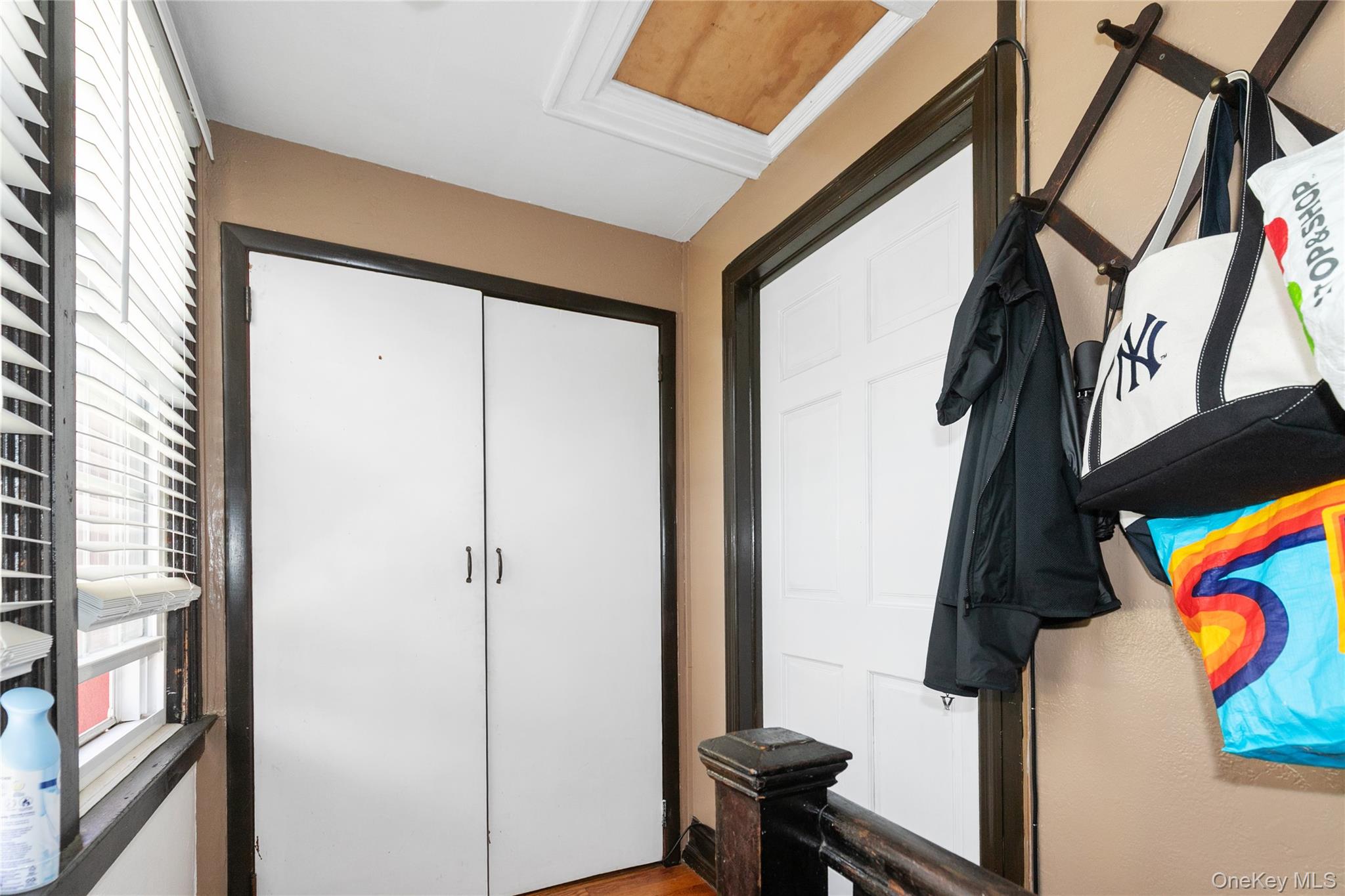8713 135th Street, Unit 3 Queens, NY 11418 - Photo 9 of 22 a view of an entryway with wooden floor