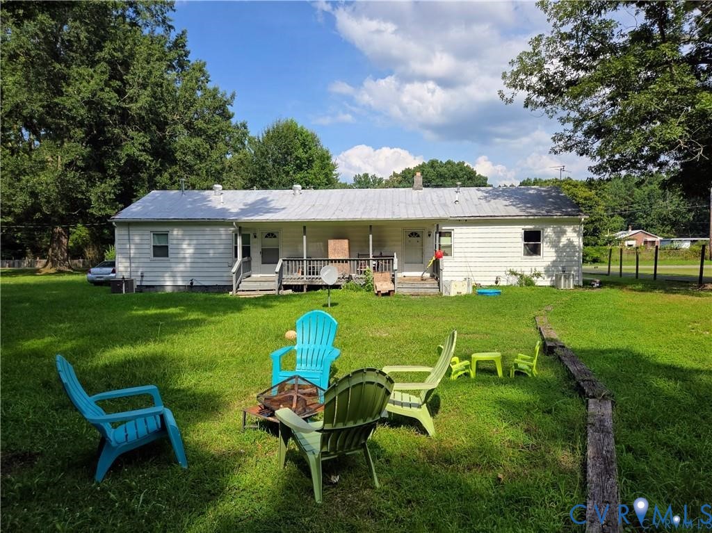 14204 Arwood Road Disputanta, VA 23842 - Photo 11 of 12 a view of a house with a yard porch and sitting area