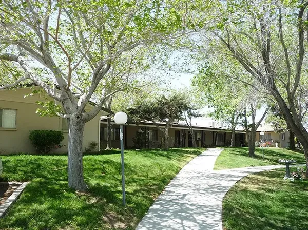 a swimming pool with outdoor seating and yard