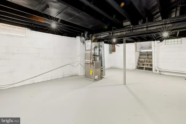 a view of empty room with wooden ceiling