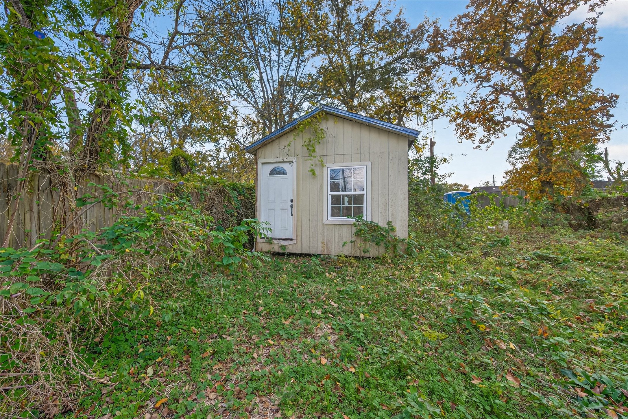 a house with trees in the background