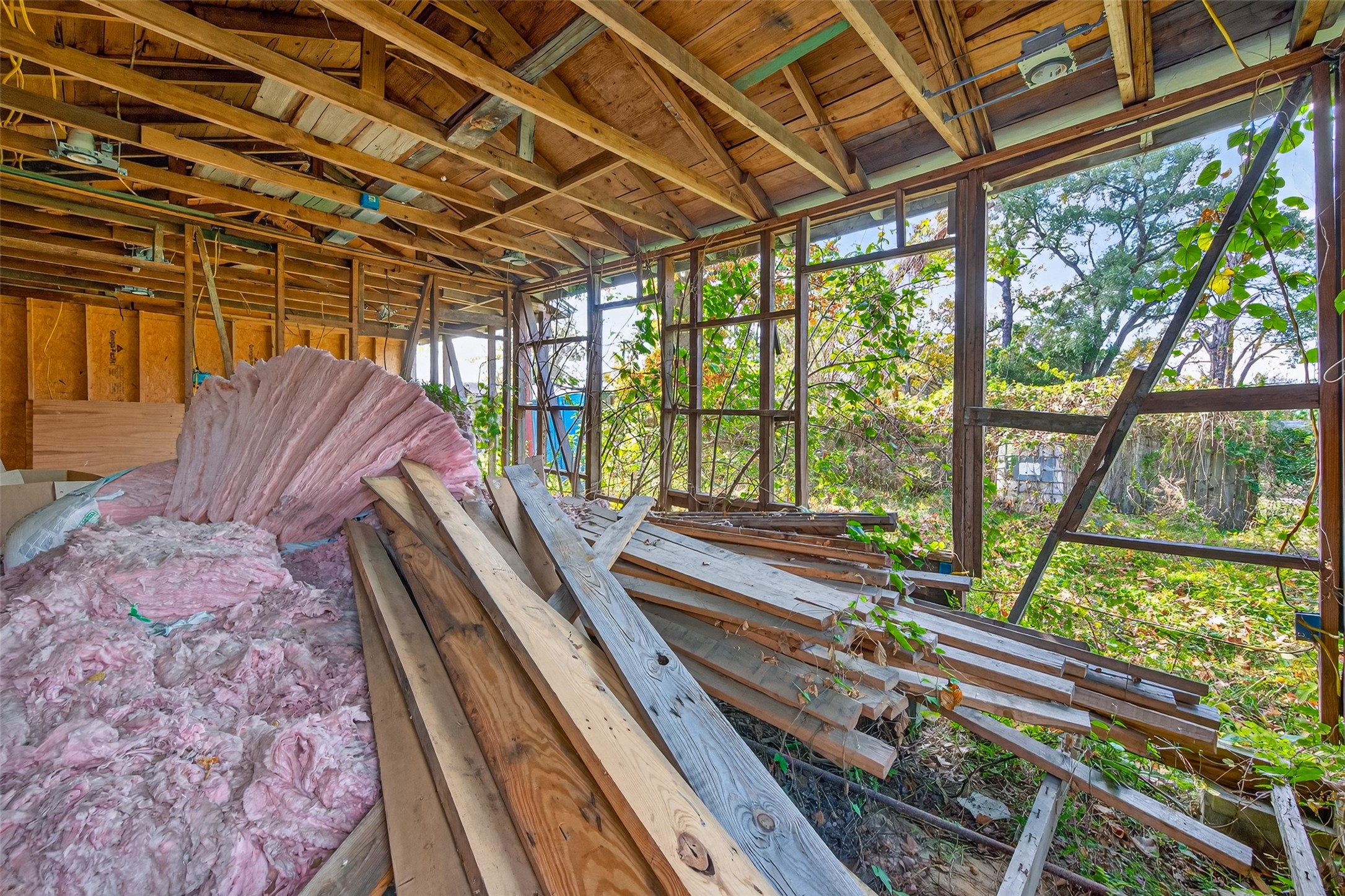 5002 Firnat Street Houston, TX 77016 - Photo 3 of 8 a view of a balcony with wooden floor and outdoor space