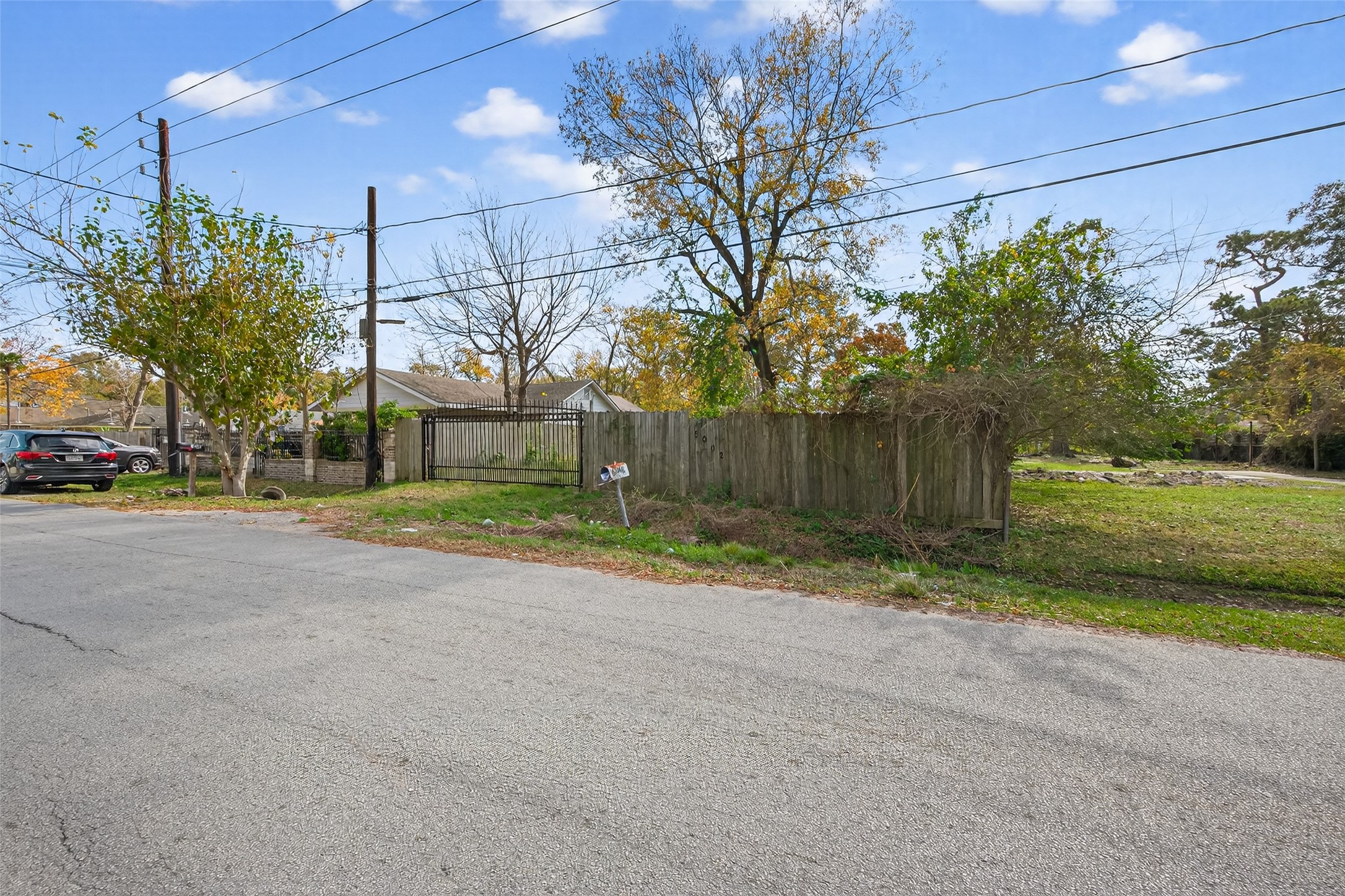 5002 Firnat Street Houston, TX 77016 - Photo 7 of 8 a view of a house with a yard and garage