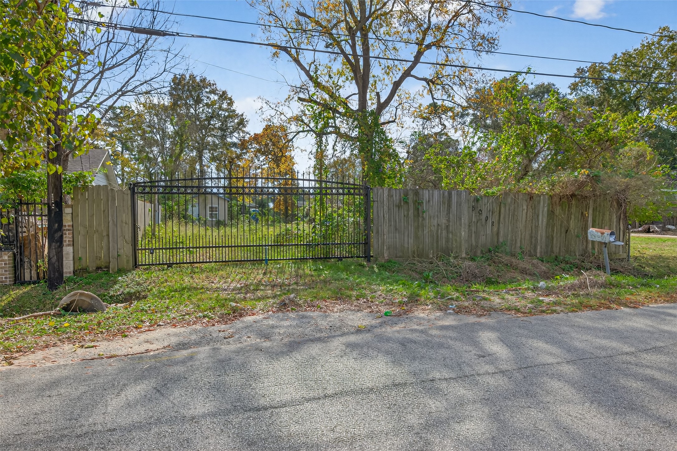 5002 Firnat Street Houston, TX 77016 - Photo 8 of 8 a backyard of a house and trees