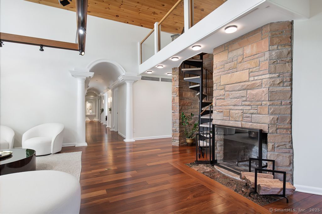 5 Mohawk Lane Woodbridge, CT 06525 - Photo 15 of 28 a view of livingroom with furniture and wooden floor