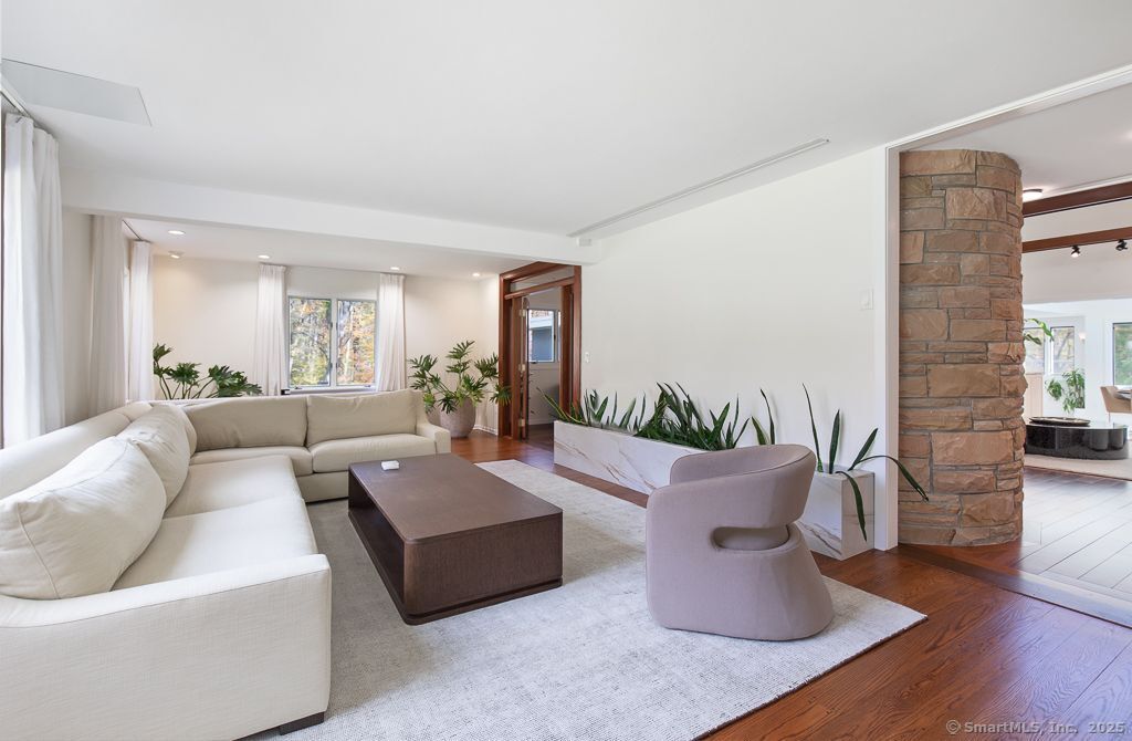 5 Mohawk Lane Woodbridge, CT 06525 - Photo 17 of 28 a living room with furniture and a large window