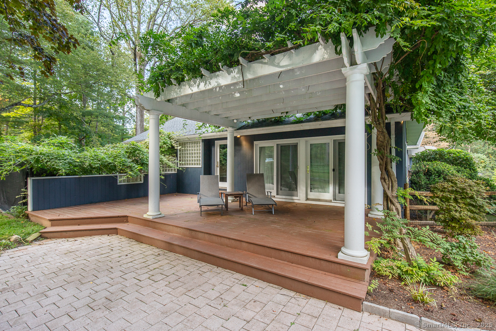 5 Mohawk Lane Woodbridge, CT 06525 - Photo 26 of 28 a house with trees in front of it