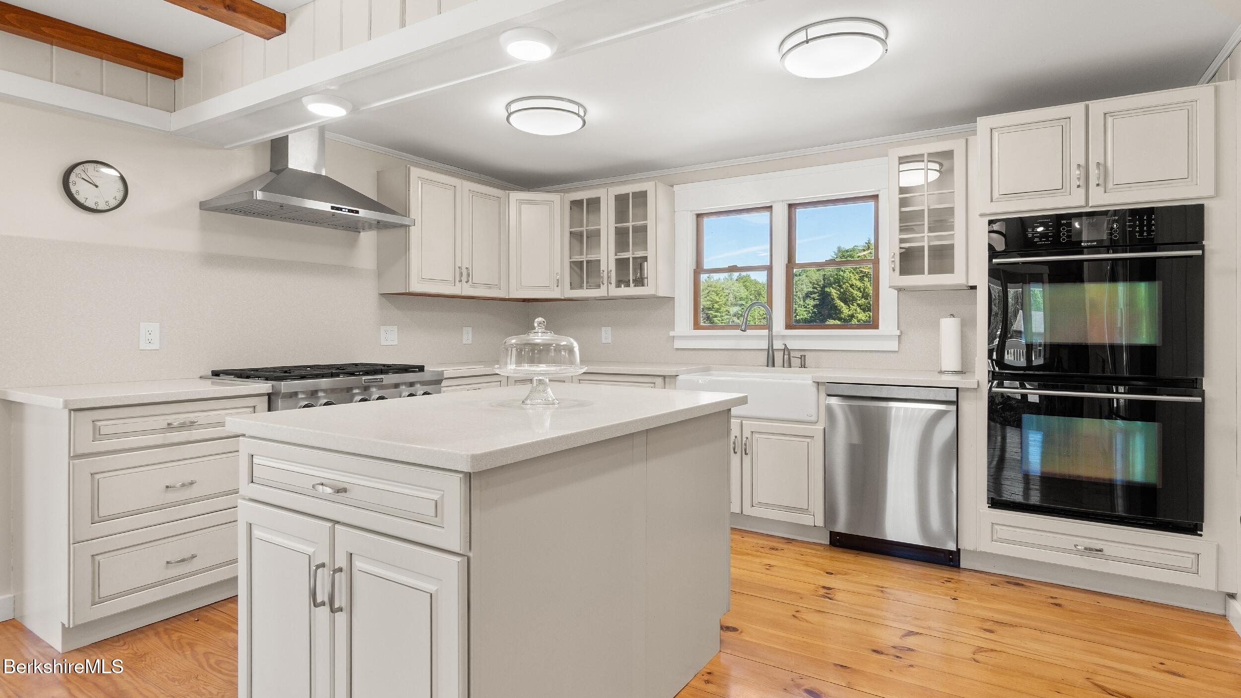 134 Hurlburt Road Great Barrington, MA 01230 - Photo 16 of 50 a kitchen with a stove a sink and a microwave