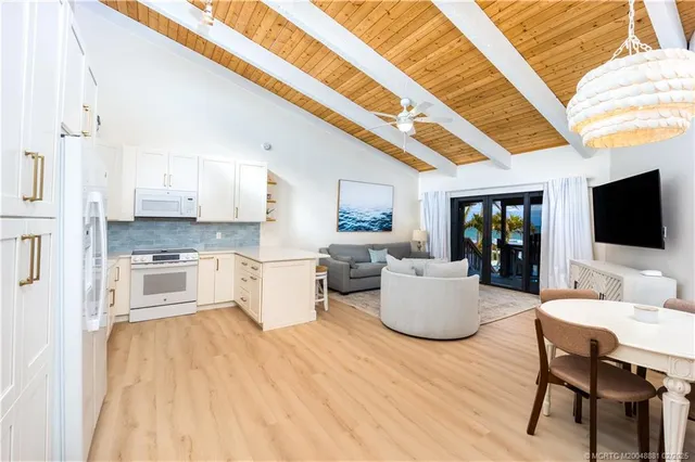 a living room with furniture and flat screen tv