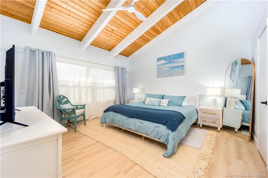 2355 Northeast Ocean Boulevard, Unit 19B Stuart, FL 34996 - Photo 14 of 20 a spacious bedroom with a bed and large windows