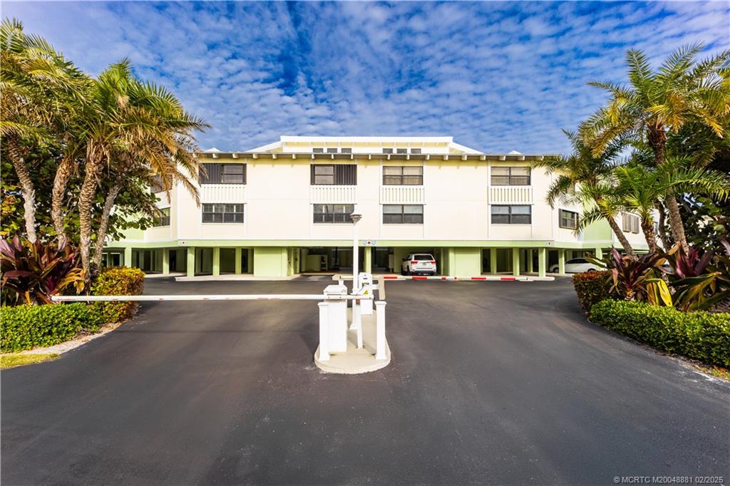 2355 Northeast Ocean Boulevard, Unit 19B Stuart, FL 34996 - Photo 19 of 20 a view of a building with a lot of trees