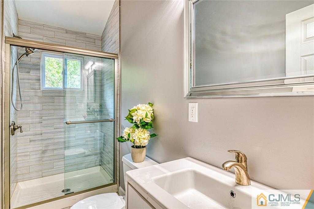 26 Colburn Road East Brunswick, NJ 08816 - Photo 17 of 22 a bathroom with a sink and shower