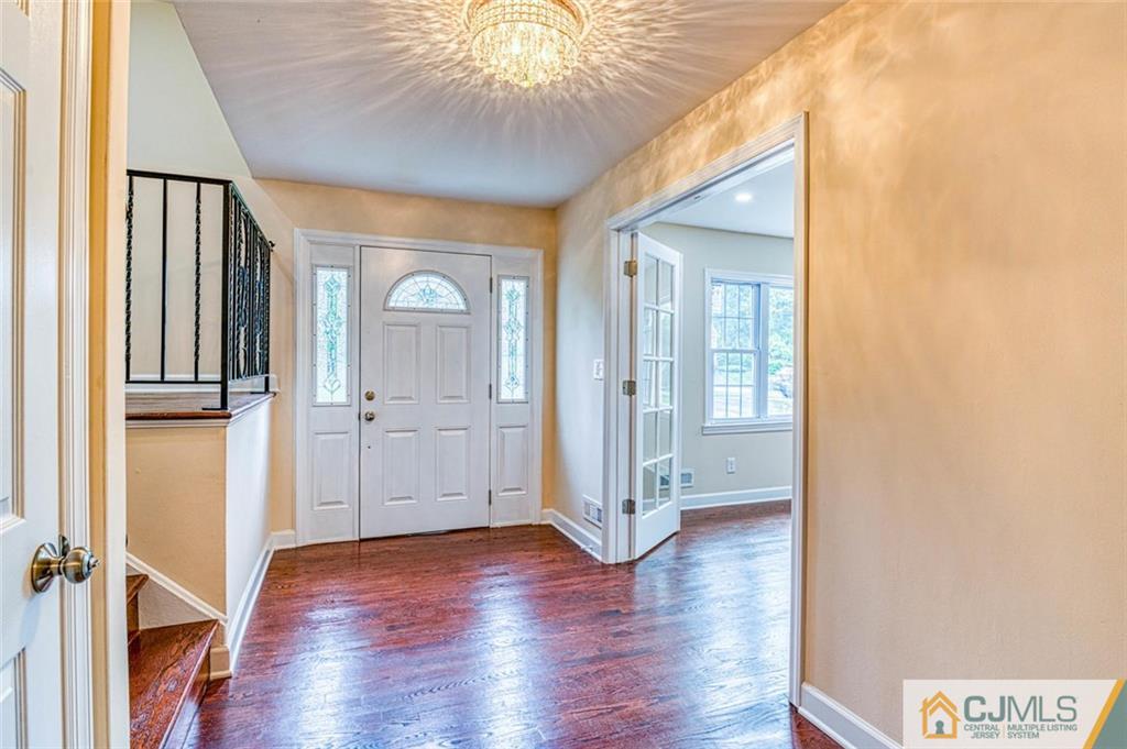 26 Colburn Road East Brunswick, NJ 08816 - Photo 20 of 22 a view of a hallway with wooden floor and closet