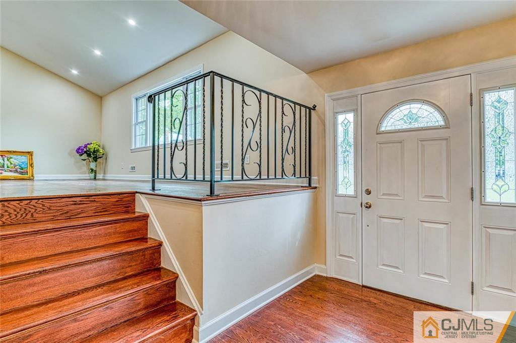 26 Colburn Road East Brunswick, NJ 08816 - Photo 3 of 22 a view of entryway with wooden floor and a front door