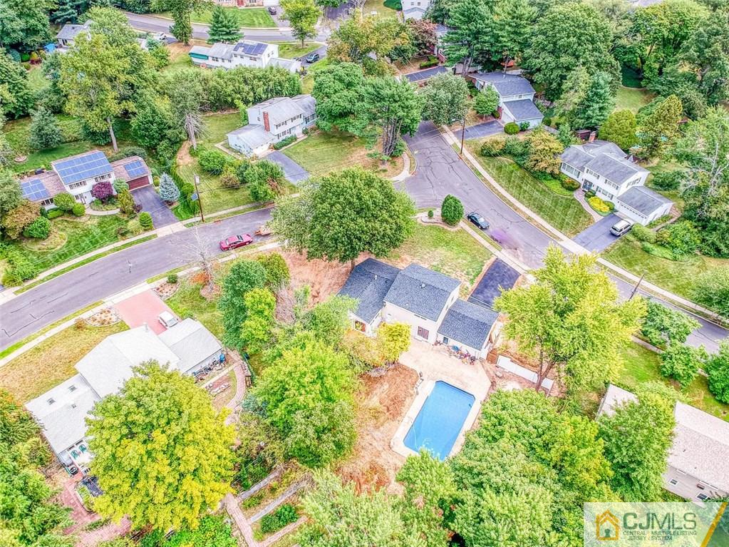 26 Colburn Road East Brunswick, NJ 08816 - Photo 22 of 22 an aerial view of a house with a garden and lake view