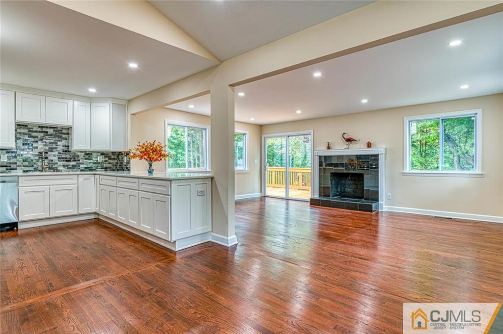 26 Colburn Road East Brunswick, NJ 08816 - Photo 4 of 22 a kitchen with stainless steel appliances granite countertop a stove and a wooden floors