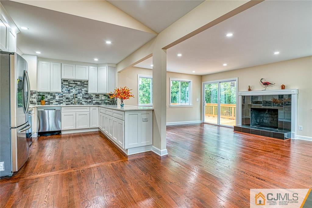 26 Colburn Road East Brunswick, NJ 08816 - Photo 5 of 22 a kitchen with stainless steel appliances granite countertop a stove and cabinets