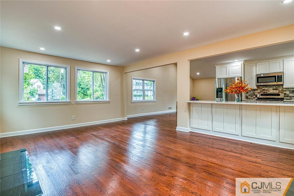 26 Colburn Road East Brunswick, NJ 08816 - Photo 9 of 22 a view of a kitchen and window with wooden floor